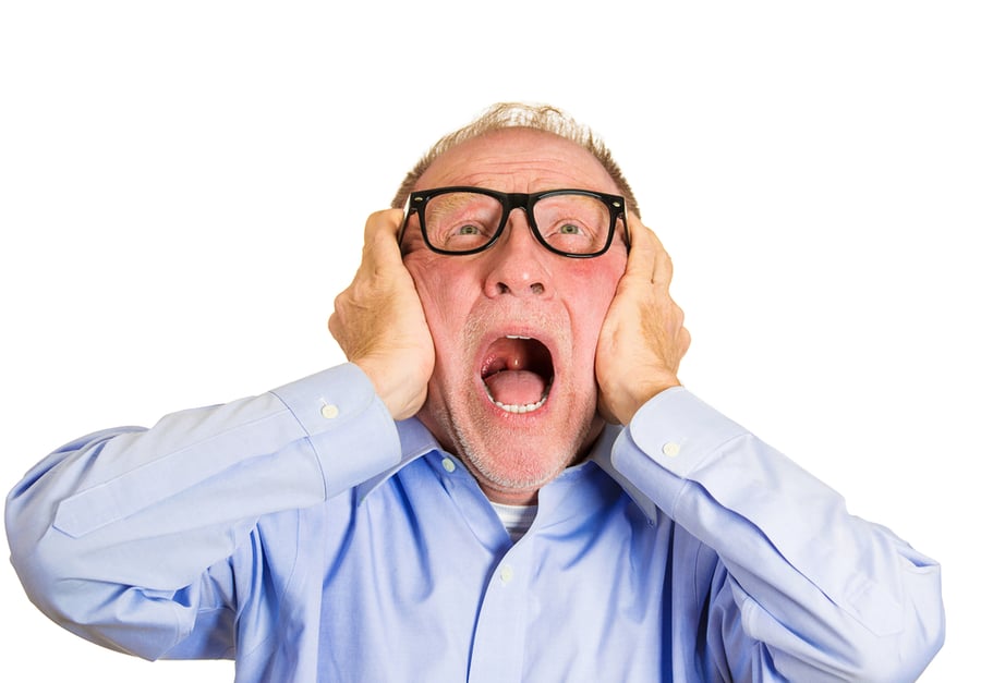 Closeup portrait, angry senior man, nerd black glasses, covering ears, looking up, to say, stop making that loud noise its giving me a headache, isolated white background. Negative human emotion