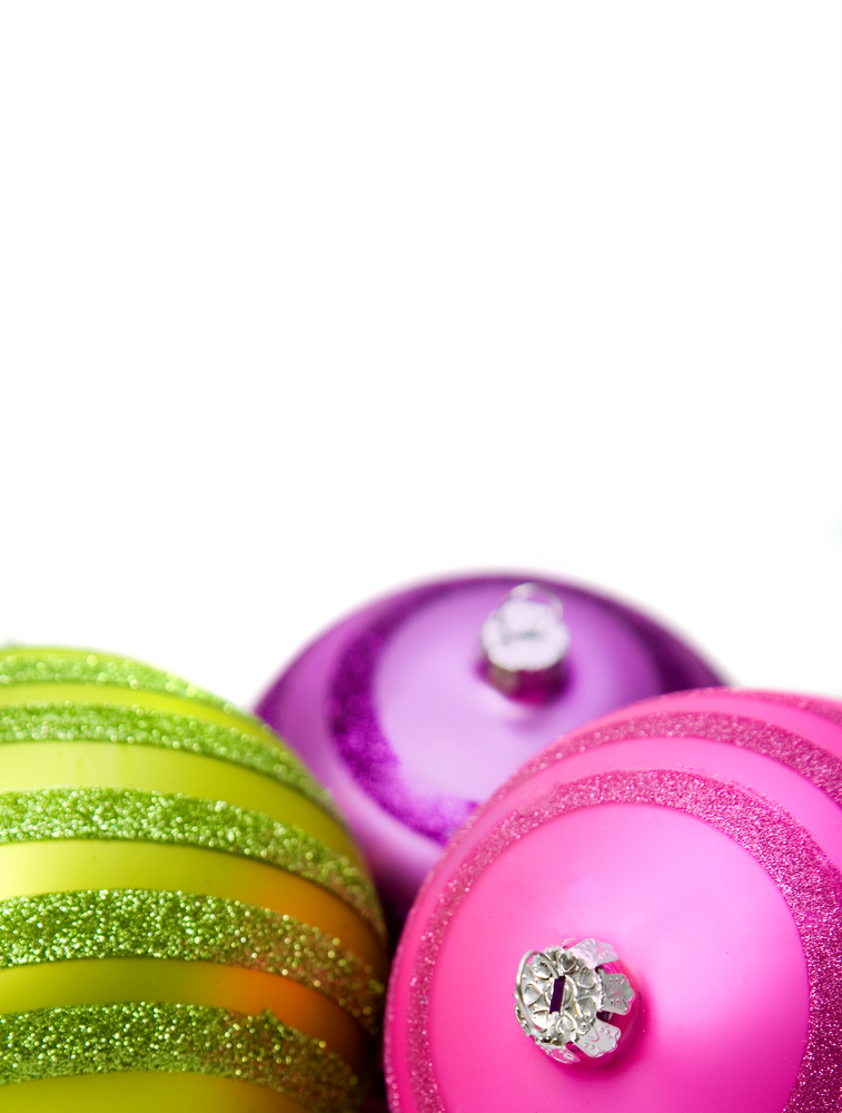 bright colored christmas balls close up on a white background